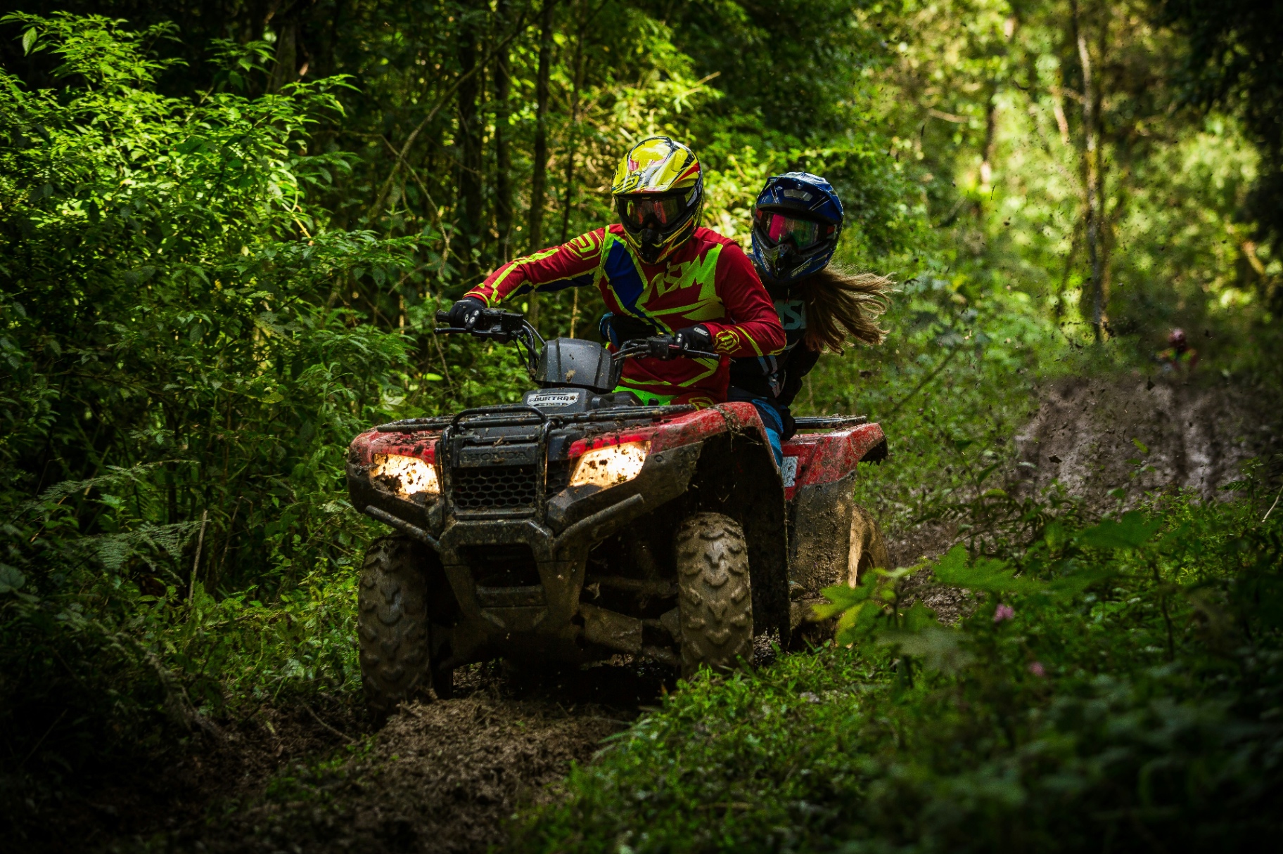 ATV riders on a scenic beach trail