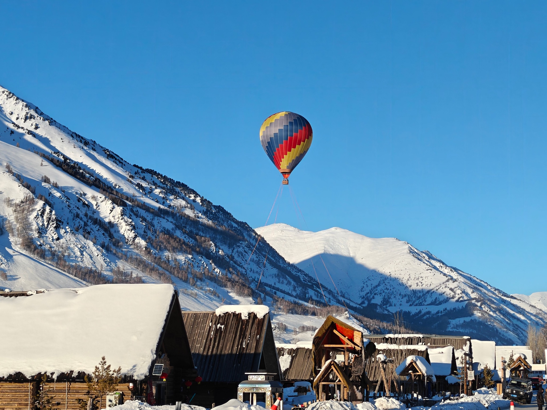 Hot air balloon flying over Jackson Hole valley